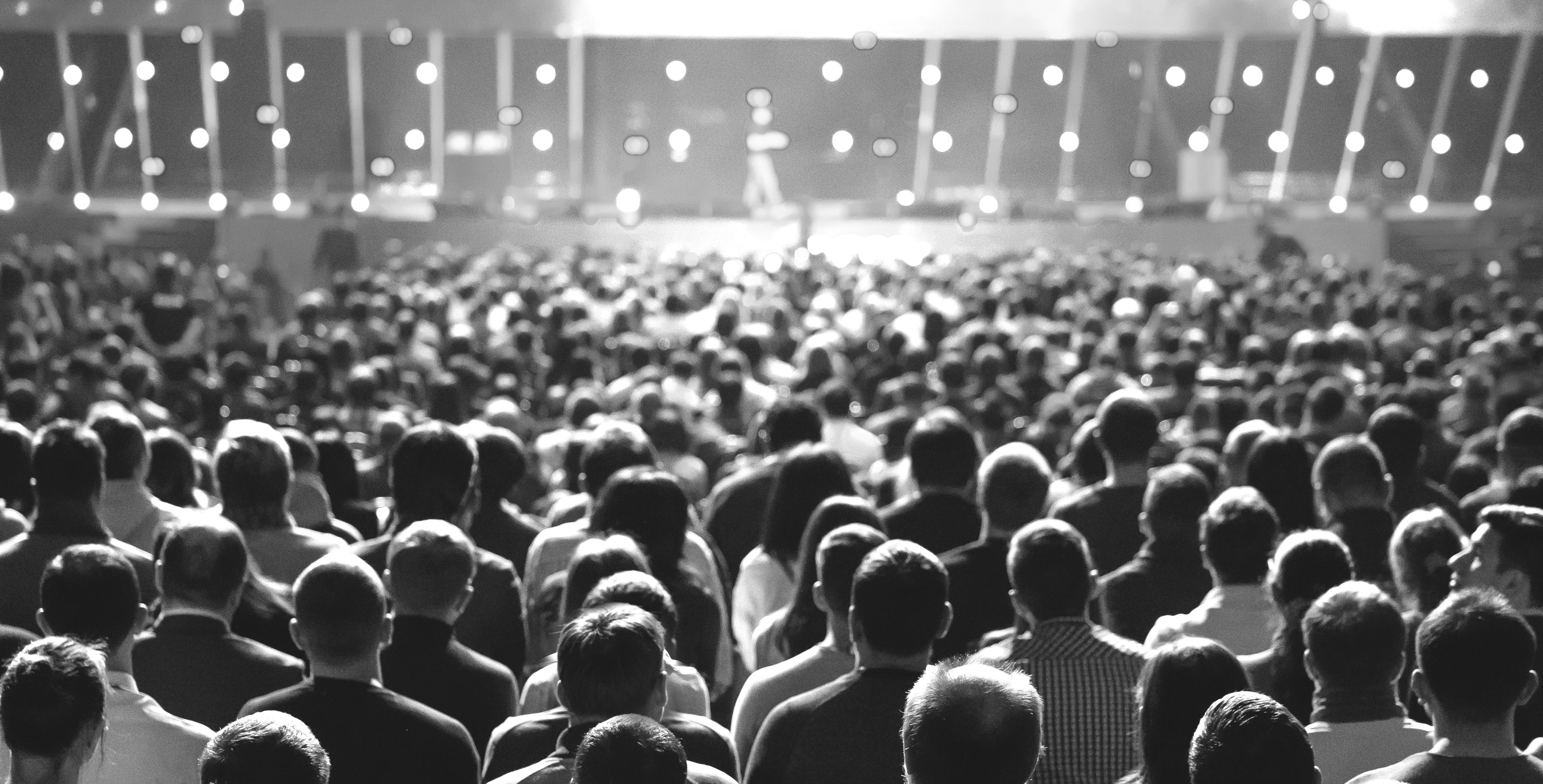 A large community gathered in an auditorium