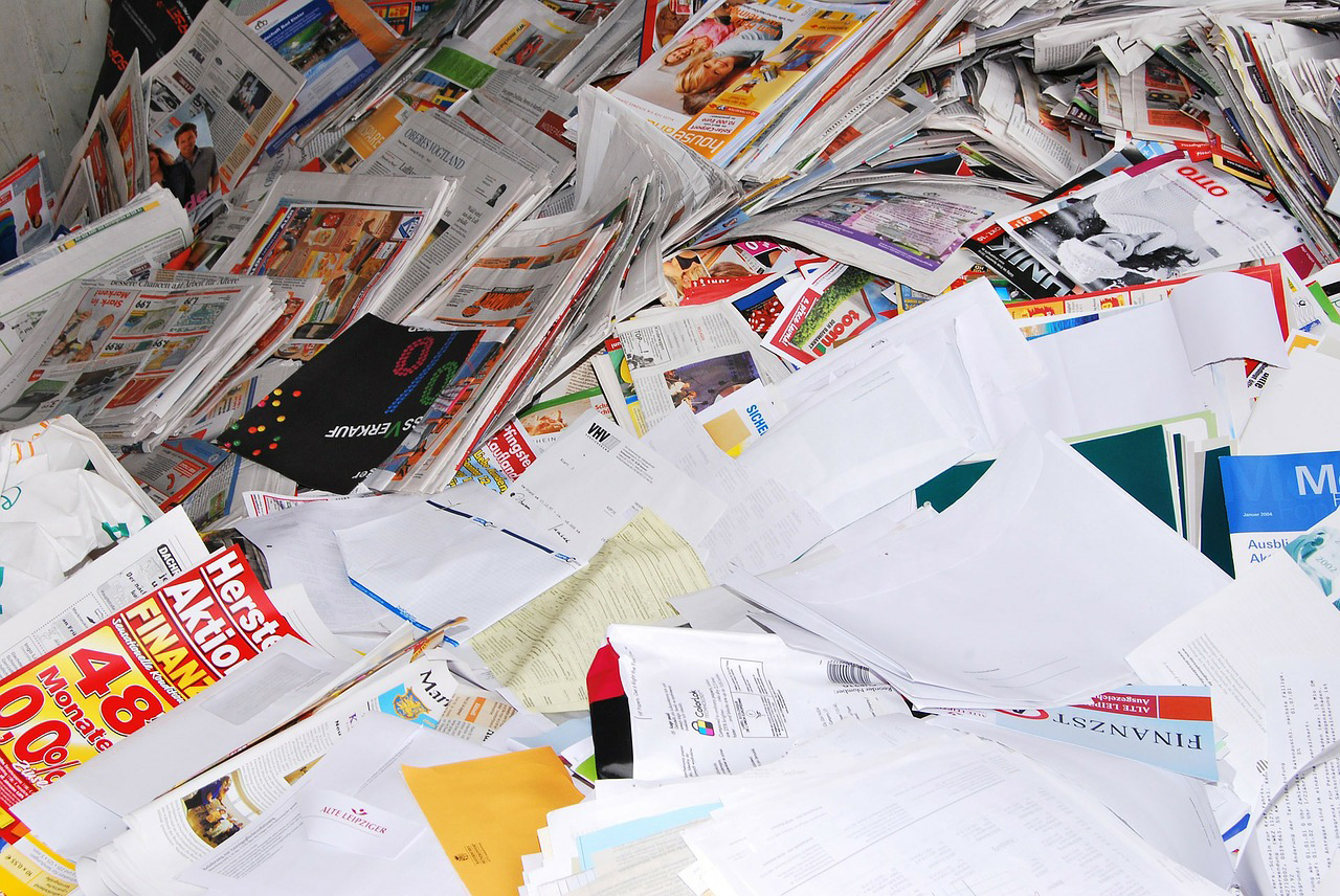 A large pile of mixed paper ready to be sorted